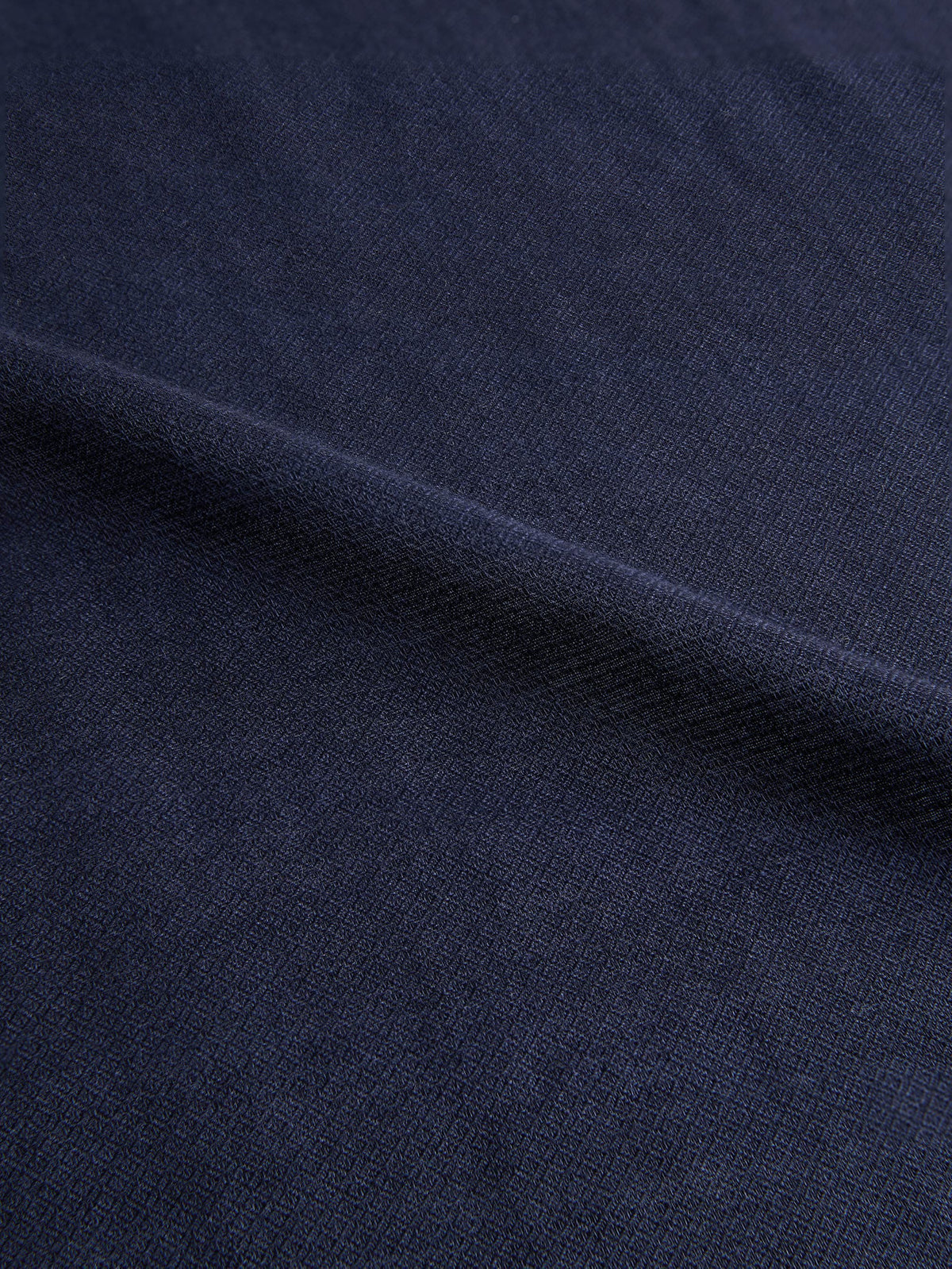 Close-up of the Midnight Blue Silk-Cashmere Scarf, showcasing the detailed micro-diamond texture of the fabric.