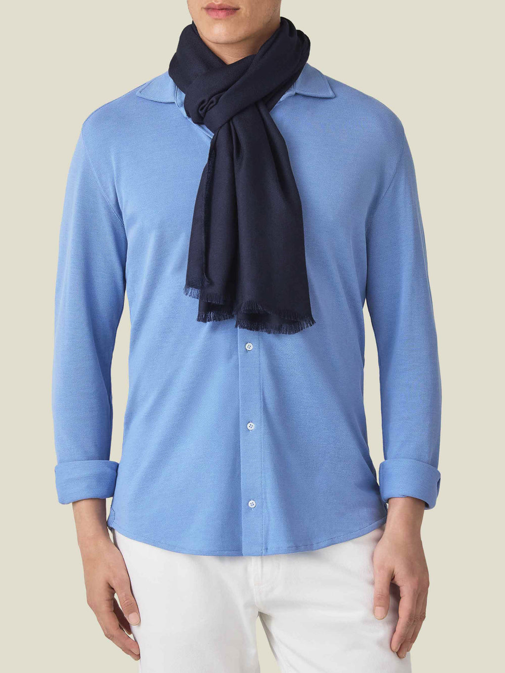 Front view of a man wearing the Luca Faloni Silk-Cashmere Scarf in Midnight Blue, styled over a light blue shirt.