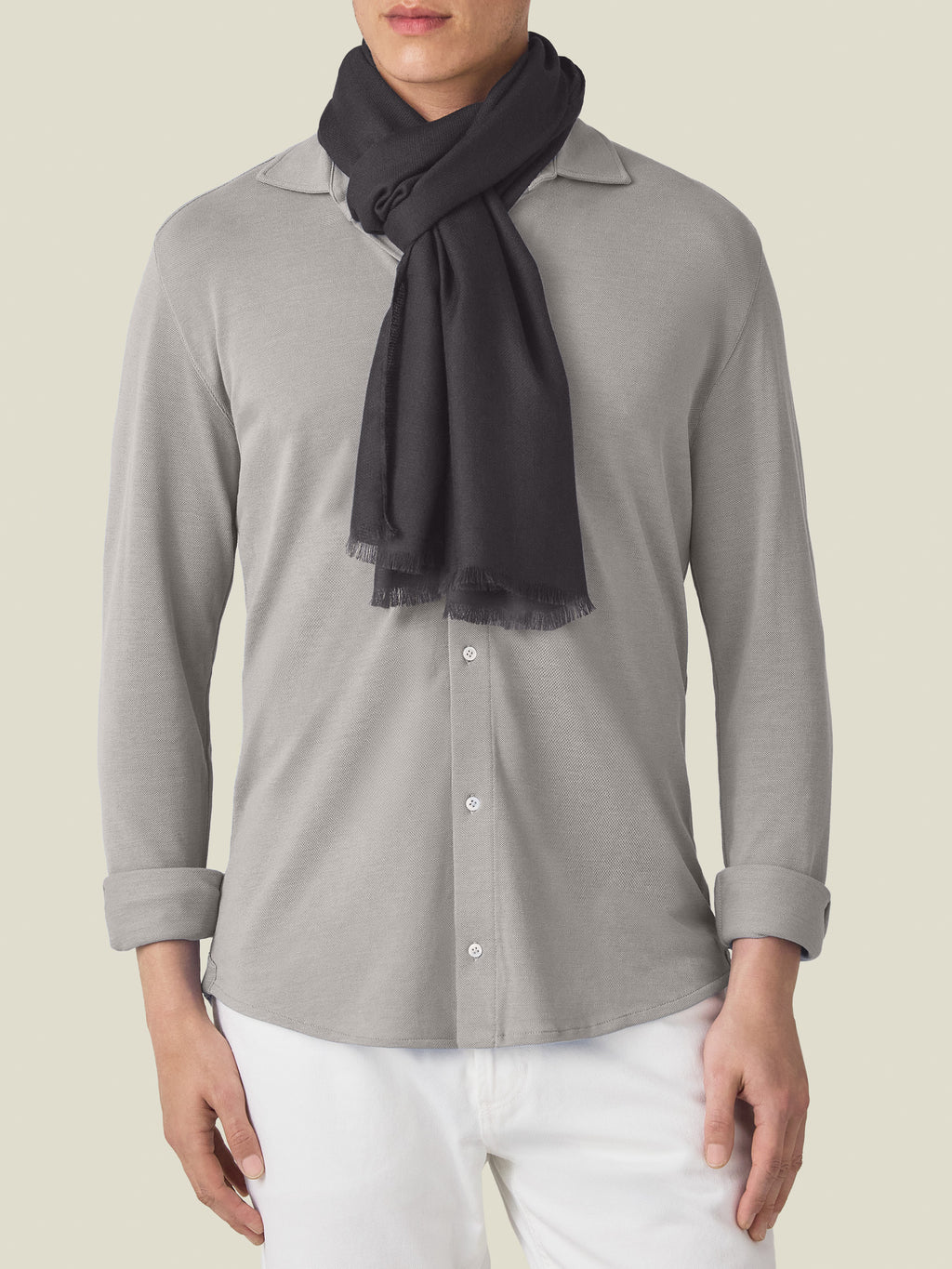 Front view of a model wearing the Luca Faloni Silk-Cashmere Scarf in charcoal grey.