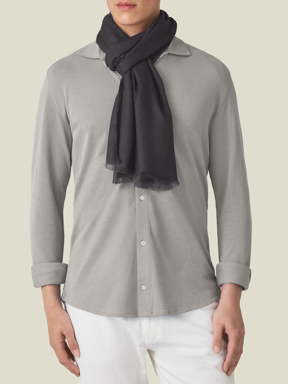 Front view of a model wearing the Luca Faloni Silk-Cashmere Scarf in charcoal grey.