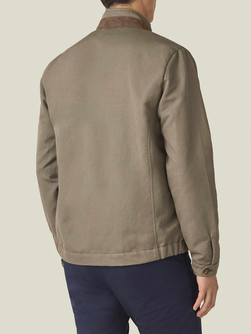 Back view of a model wearing the Luca Faloni Linen Bomber Jacket in Nocciola Brown against a plain background.