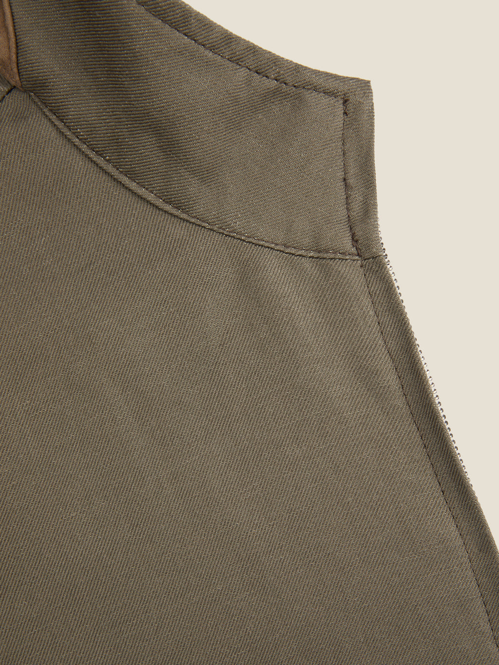 Detail shot of the collar and suede insert on the Luca Faloni Nocciola Brown Linen Bomber Jacket.