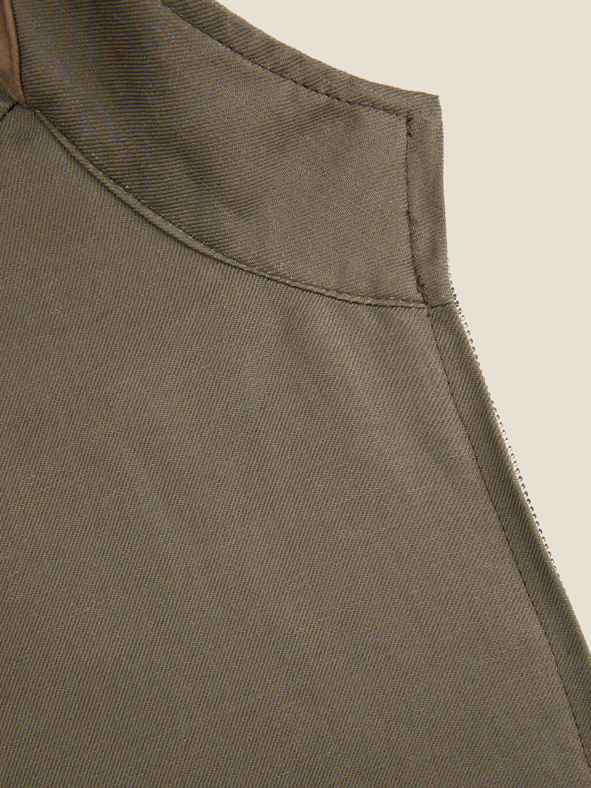 Detail shot of the collar and suede insert on the Luca Faloni Nocciola Brown Linen Bomber Jacket.