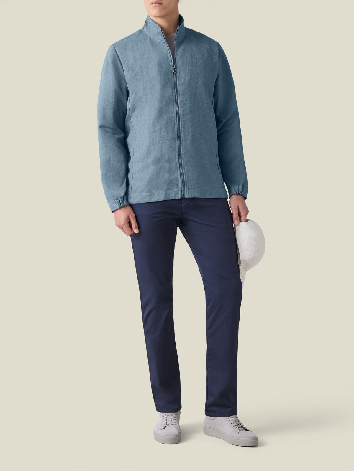 Front view of a model wearing the Luca Faloni Linen Bomber Jacket in French Blue.