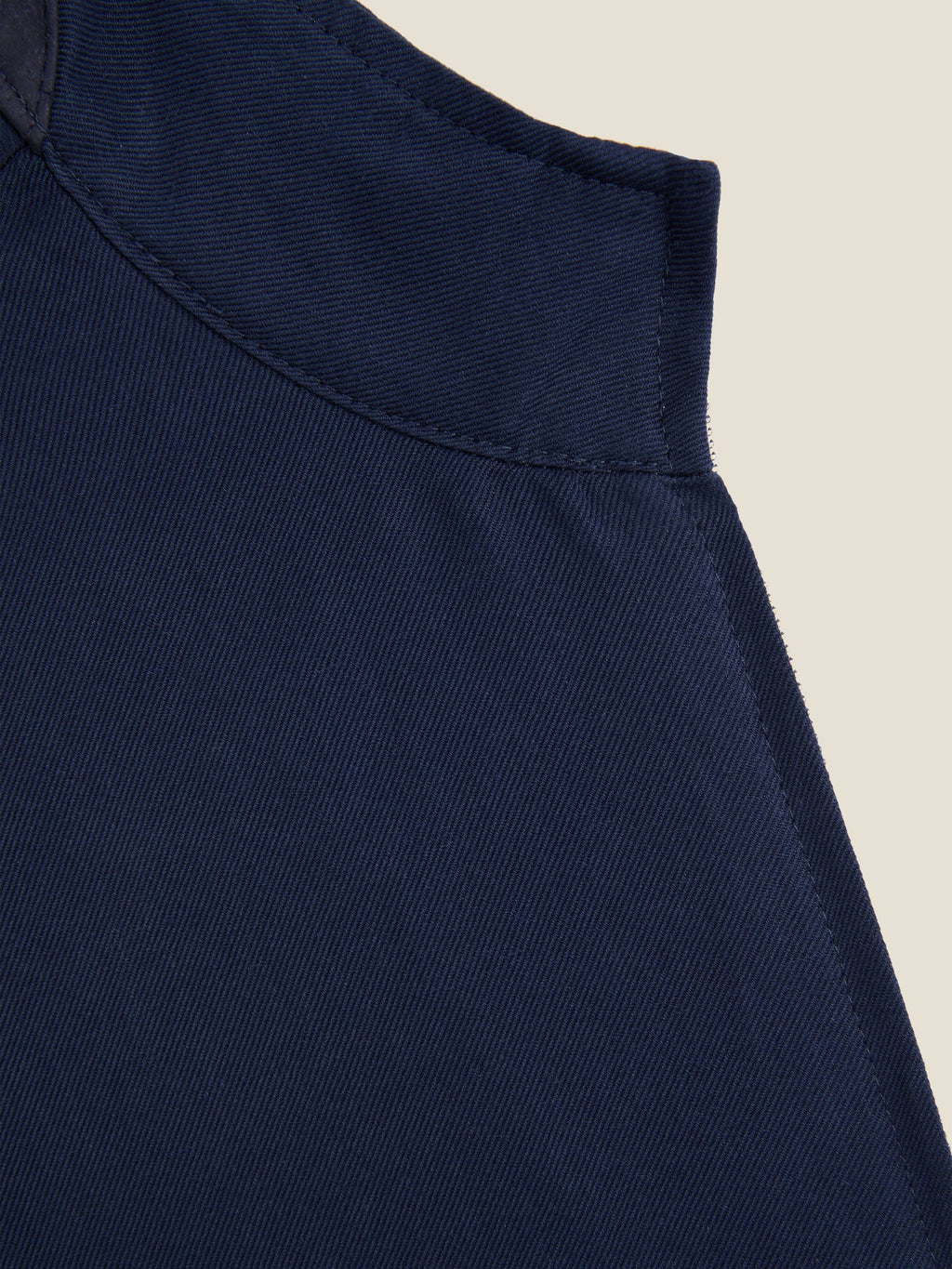 Close-up of the collar on the Midnight Blue Linen Bomber Jacket, showing the fine stitching and soft linen-cotton fabric.