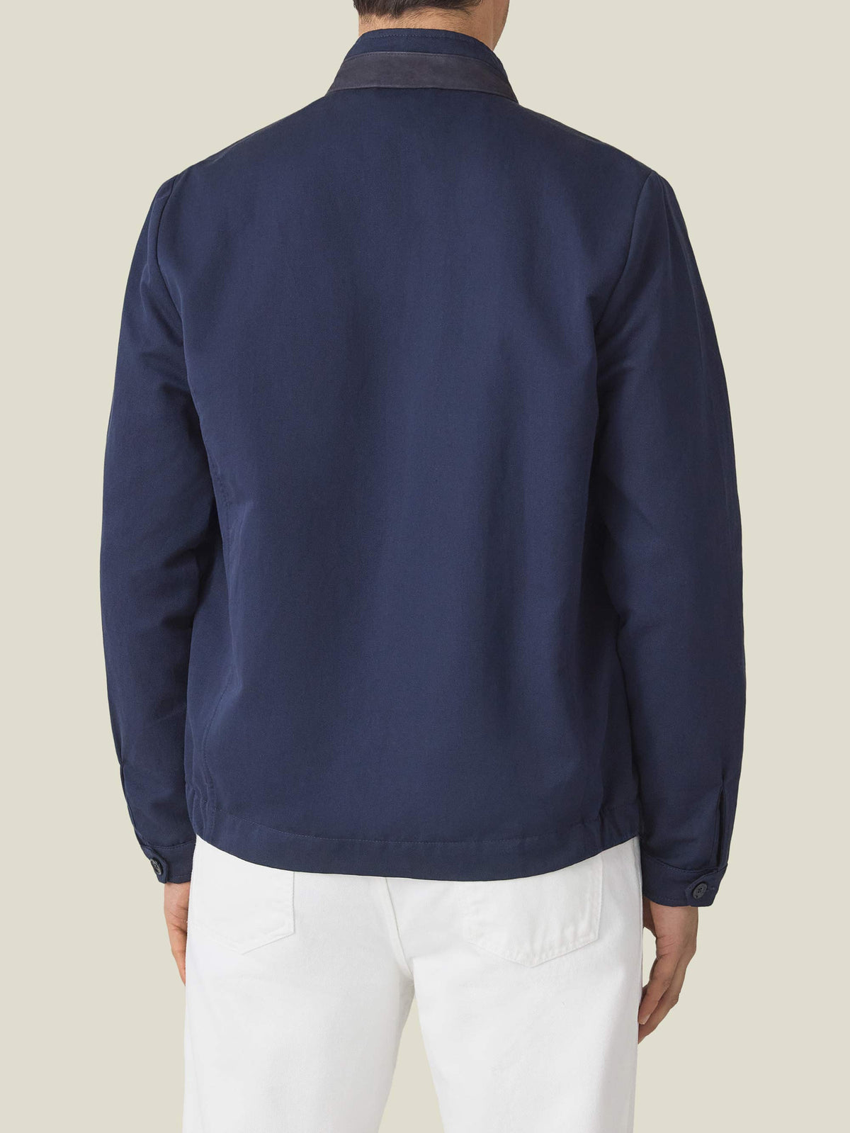 Back view of a model wearing the Midnight Blue Linen Bomber Jacket, highlighting the contrasting suede collar insert.