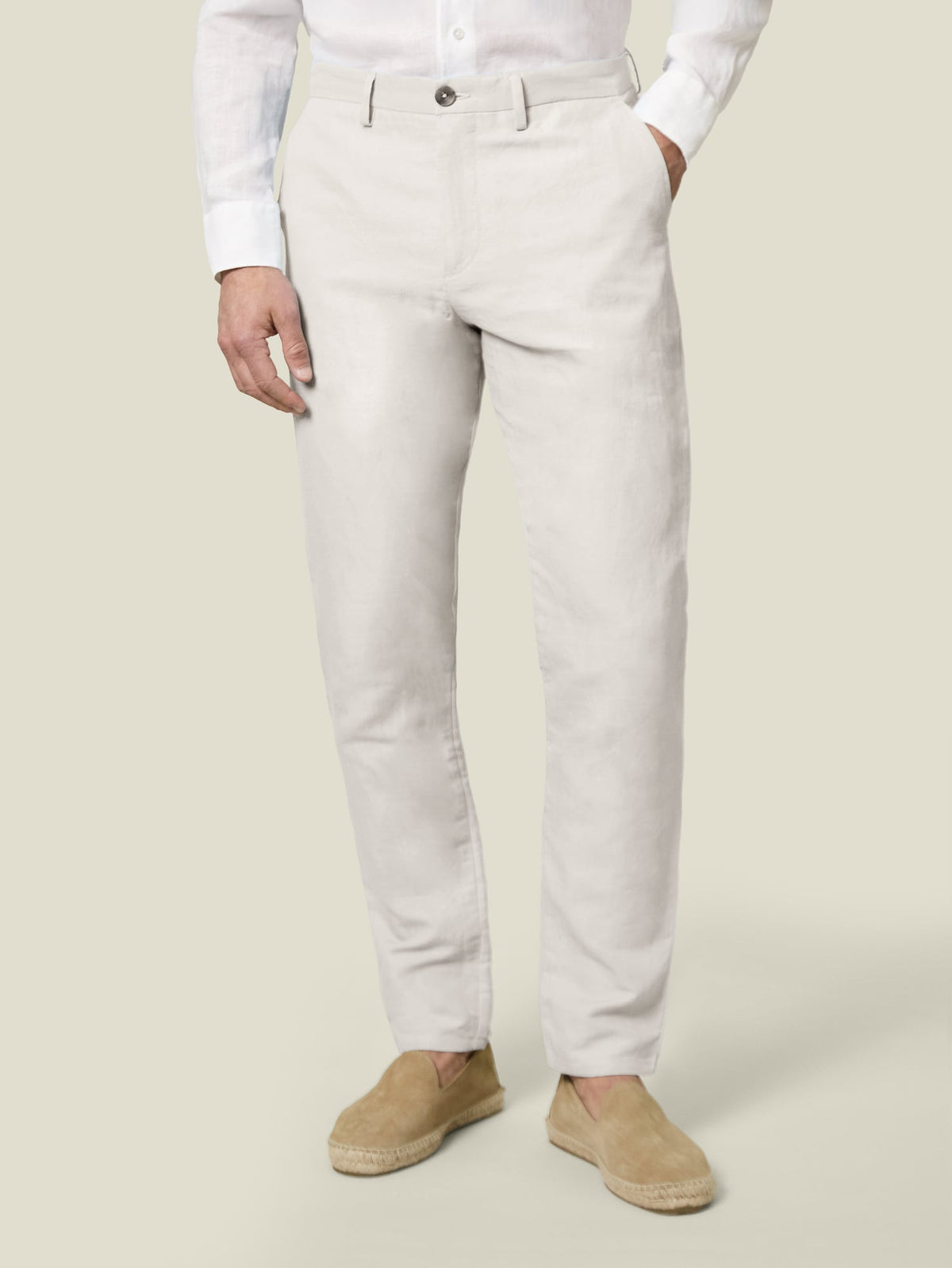 Front view of a model wearing Sand Linen Cotton Trousers, styled with a white shirt and matching espadrilles.