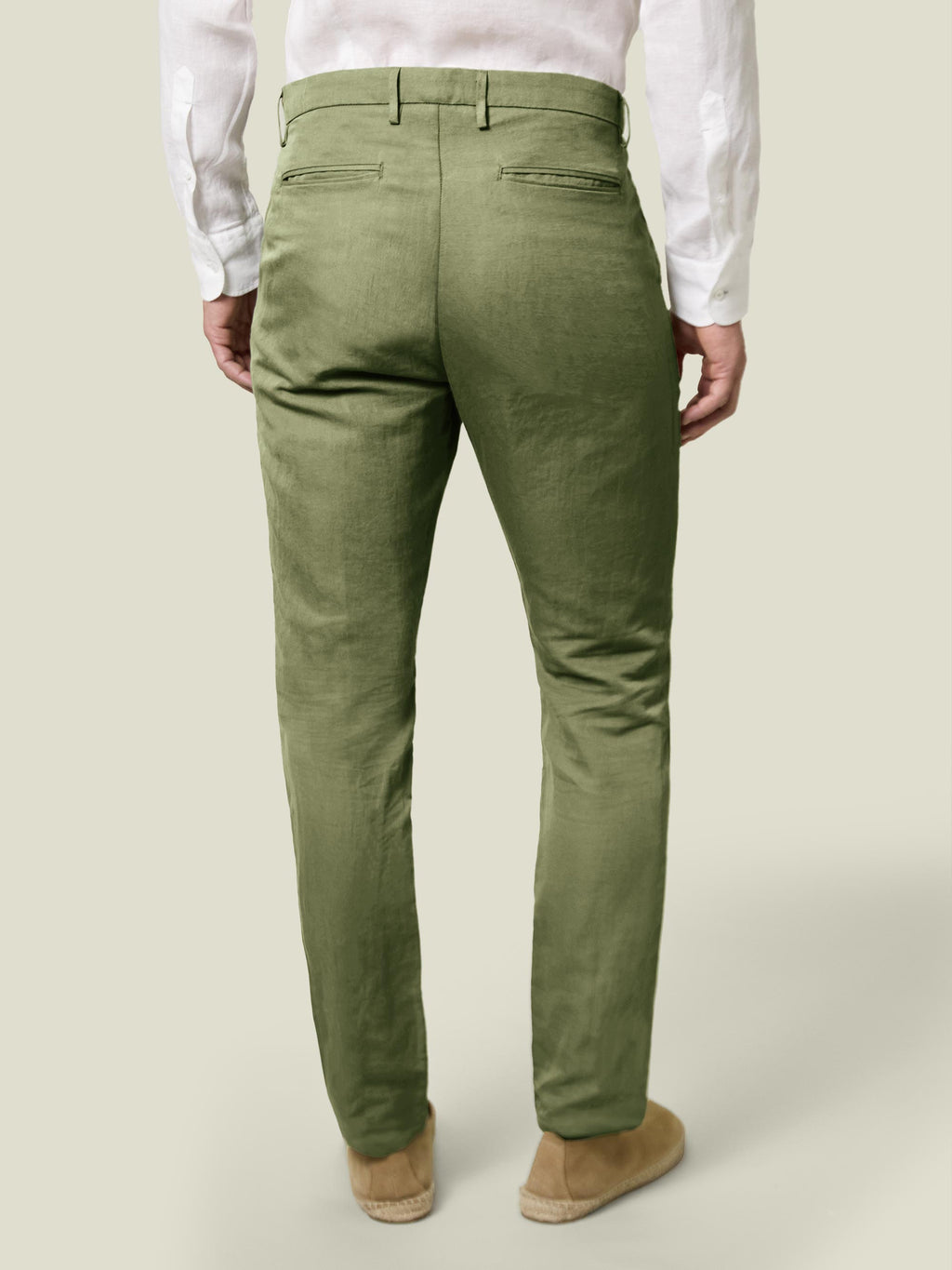 Back view of a model wearing the Sage Green Linen Cotton Trousers.