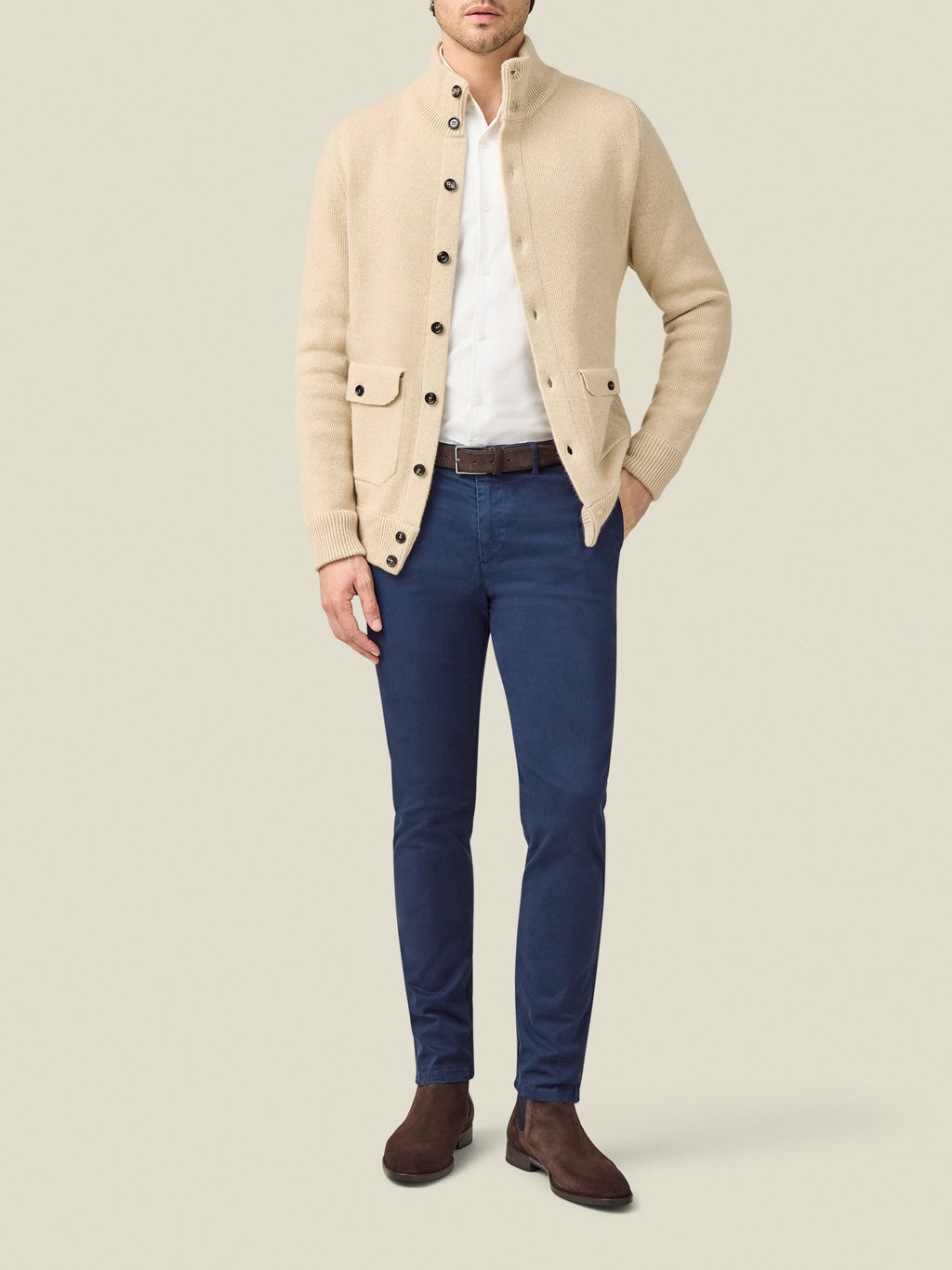Front view of a model wearing the Luca Faloni Cashmere Bomber in Oatmeal with a white shirt and blue trousers.