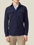 Front view of a model wearing the Luca Faloni Cashmere Overshirt in Midnight Blue over a light blue shirt and beige trousers.