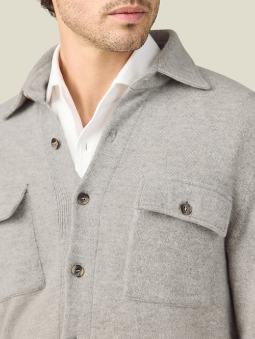 A close-up of the Luca Faloni Cashmere Overshirt in Light Grey, showing the spread collar, horn buttons, and cashmere fabric.