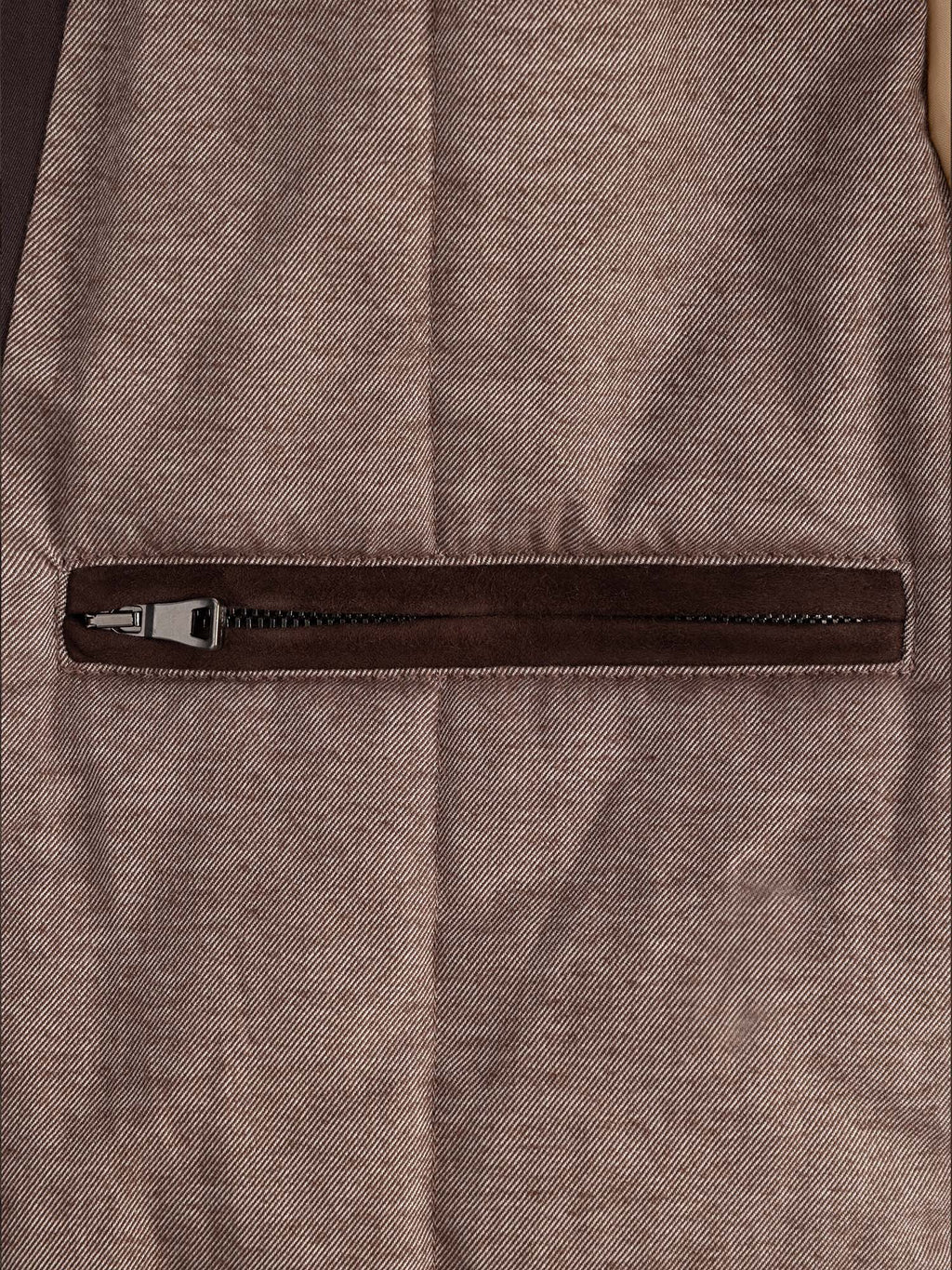 Close-up of the internal zipped pocket of the Luca Faloni City Jacket in Chocolate Brown, showing the suede trim.