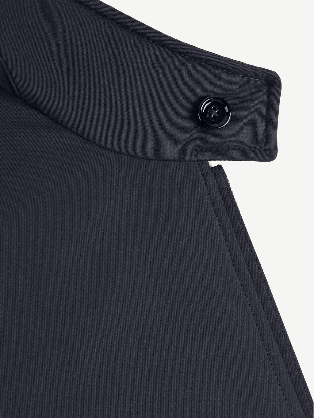 Close-up of the upright collar and horn button of the Luca Faloni City Jacket in midnight blue.