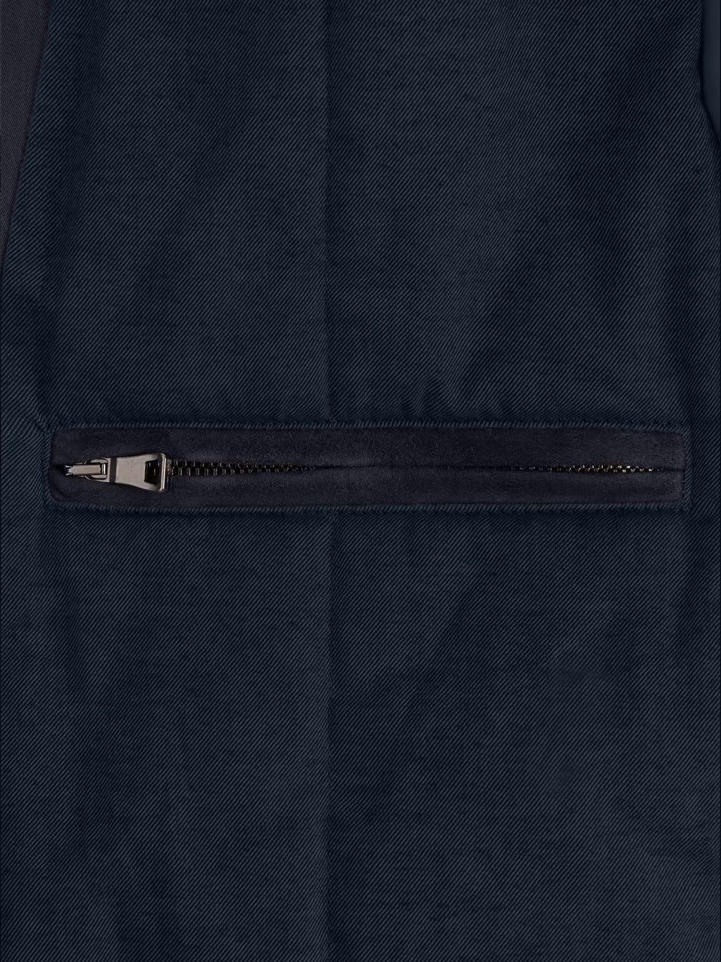 Detail of the external zipped pocket on the Luca Faloni City Jacket in midnight blue.