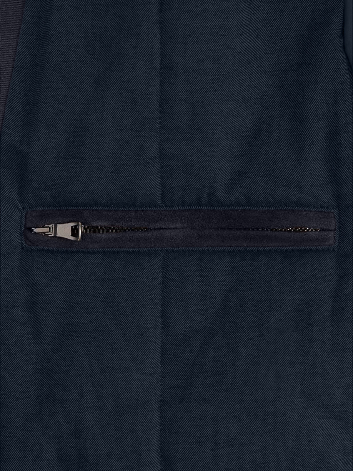 Detail of the external zipped pocket on the Luca Faloni City Jacket in midnight blue.