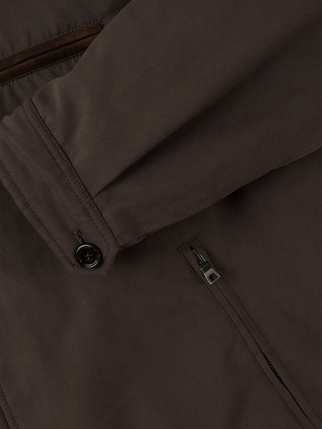 Close-up detail of the Luca Faloni City Jacket in chocolate brown, showing sleeve cuff with horn button and zipped pocket.