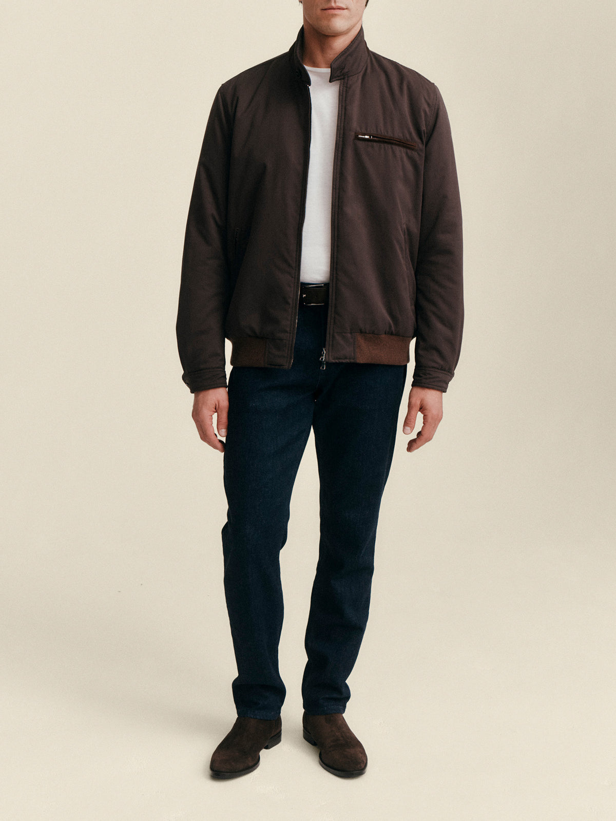 Model wearing the Luca Faloni City Jacket in chocolate brown with a white t-shirt and dark jeans.